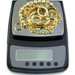 jewelry scale weigh gold on a jewelry scale set to pennyweight